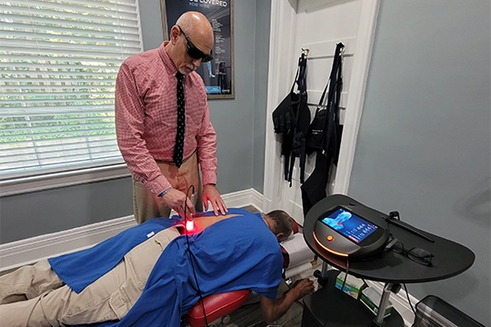 Chiropractor Winston-Salem NC Steven Rubin Using Laser -Machine